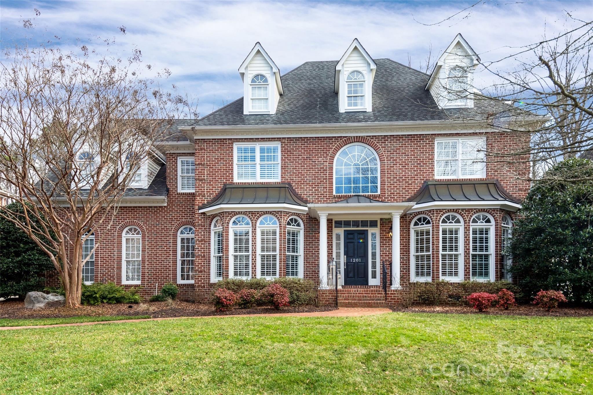 1201 Lost Oak Road Charlotte, NC 28270 - Photo 46 of 46 front view of a brick house with a yard