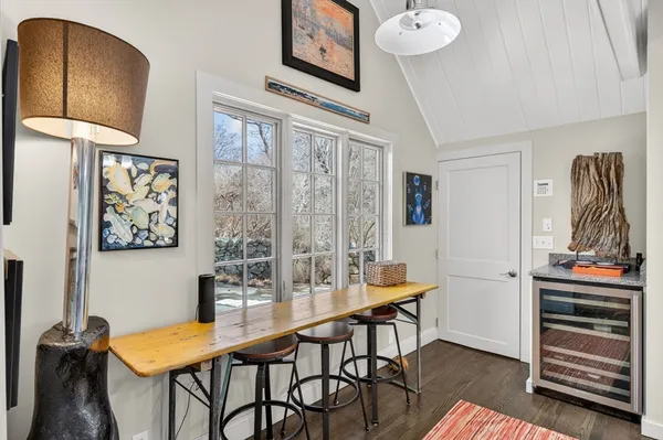 a dining room with furniture and window