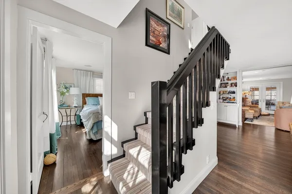 a view of entryway and hall with wooden floor