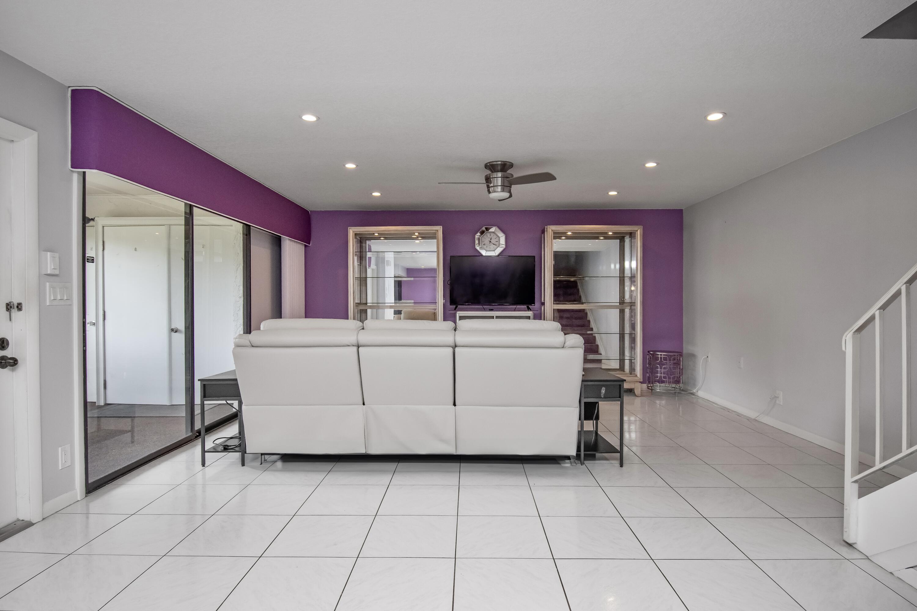 9460 Southwest 61st Way, Unit B Boca Raton, FL 33428 - Photo 13 of 31 a living room with furniture and a table