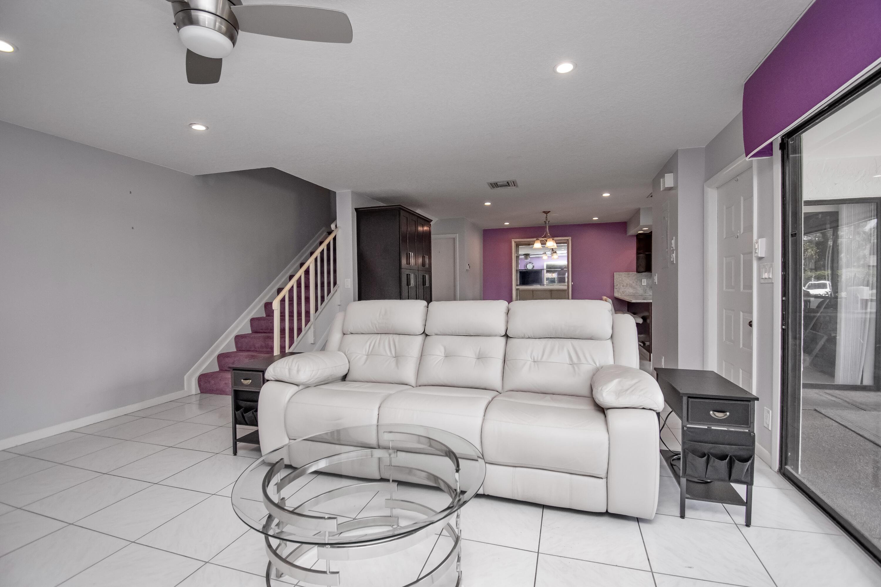 9460 Southwest 61st Way, Unit B Boca Raton, FL 33428 - Photo 14 of 31 a living room with furniture and kitchen view