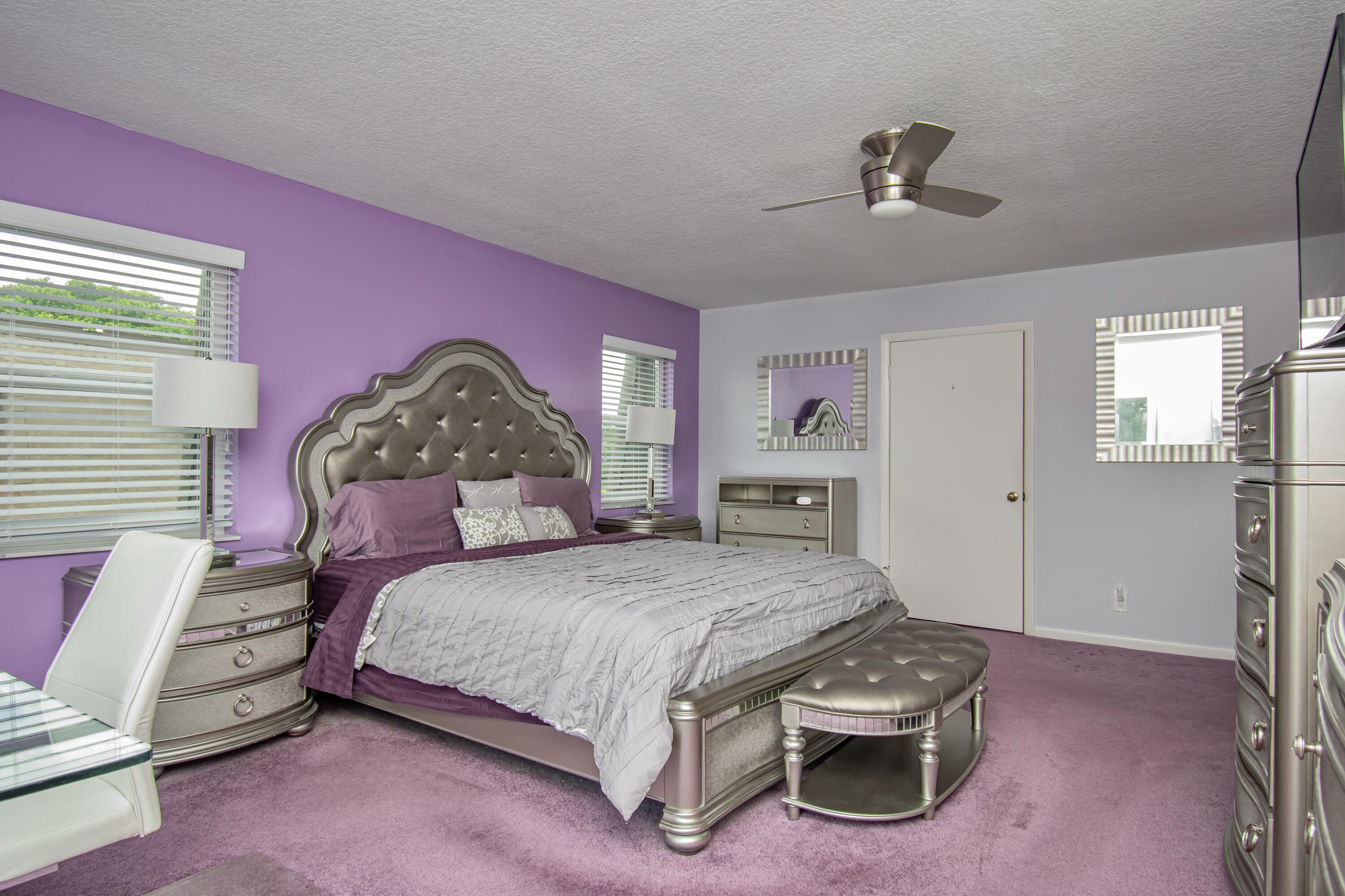 9460 Southwest 61st Way, Unit B Boca Raton, FL 33428 - Photo 18 of 31 a bedroom with a bed and a dresser