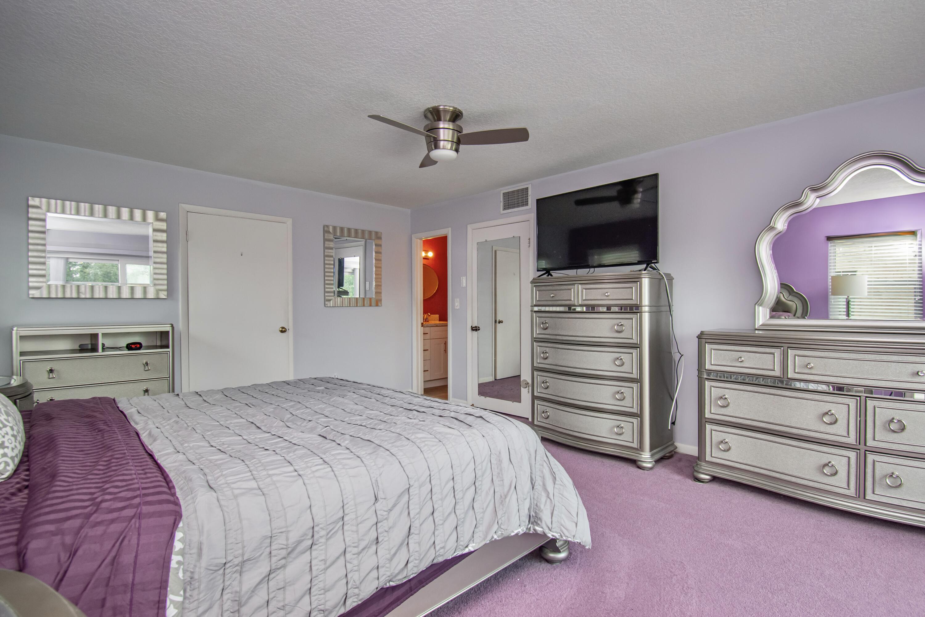 9460 Southwest 61st Way, Unit B Boca Raton, FL 33428 - Photo 19 of 31 a bed room with a bed and a television