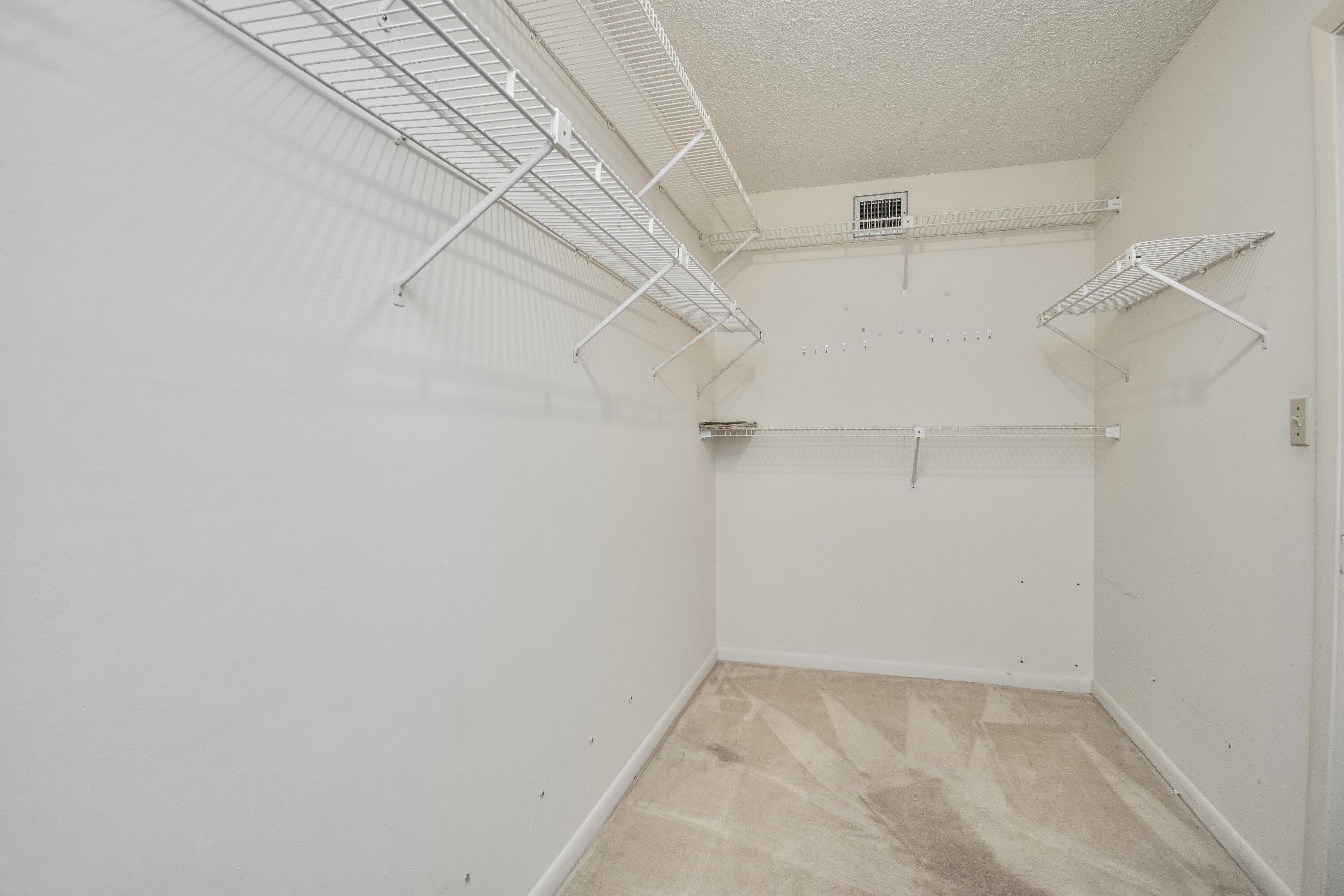 9460 Southwest 61st Way, Unit B Boca Raton, FL 33428 - Photo 20 of 31 a view of a room with racks on the wall