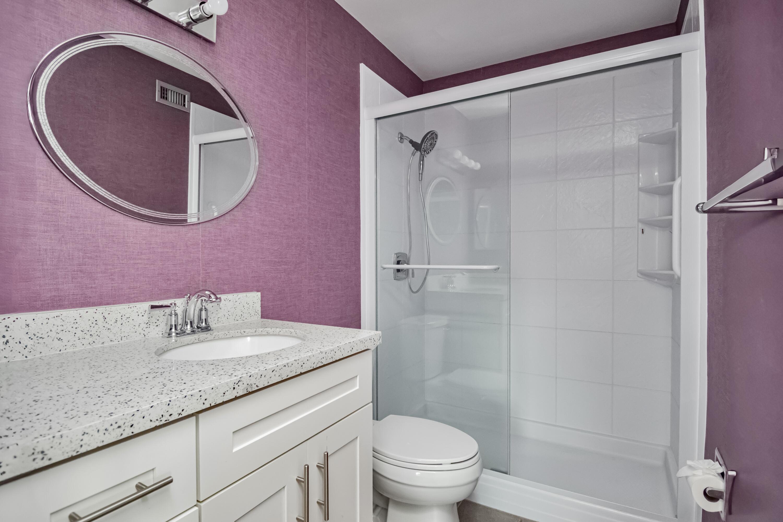 9460 Southwest 61st Way, Unit B Boca Raton, FL 33428 - Photo 21 of 31 a bathroom with a granite countertop sink toilet and shower