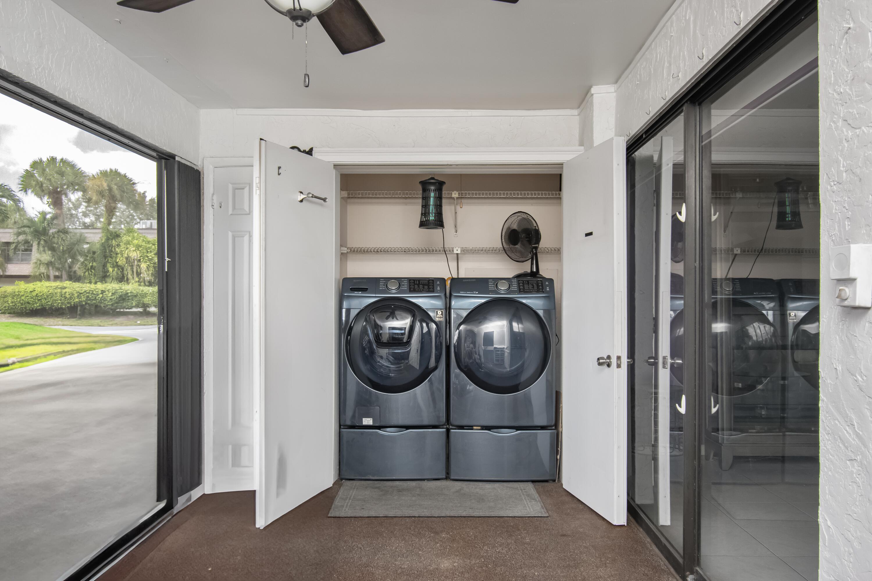 9460 Southwest 61st Way, Unit B Boca Raton, FL 33428 - Photo 26 of 31 a utility room with dryer and washer