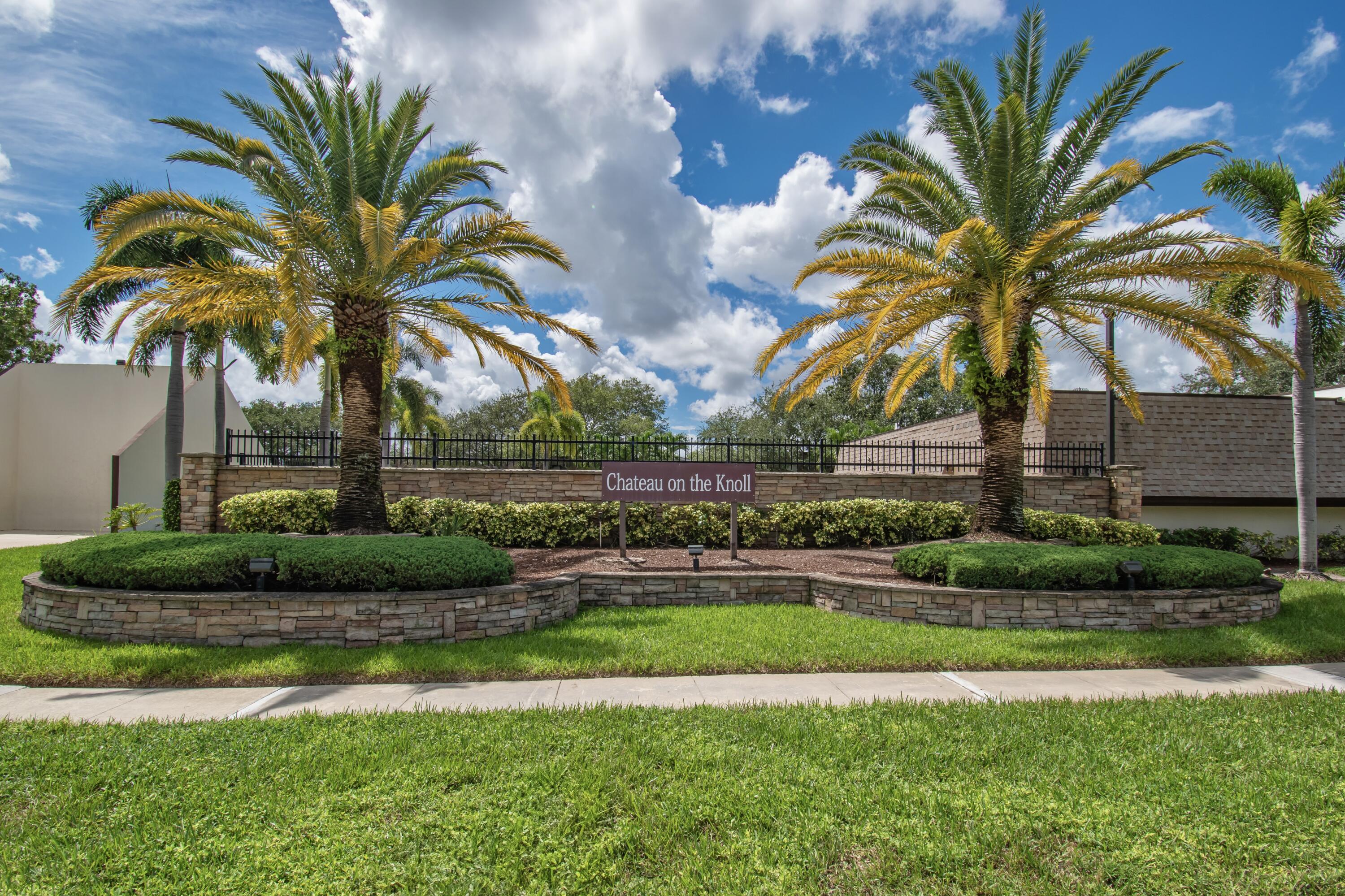 9460 Southwest 61st Way, Unit B Boca Raton, FL 33428 - Photo 27 of 31 a view of a yard with a palm trees