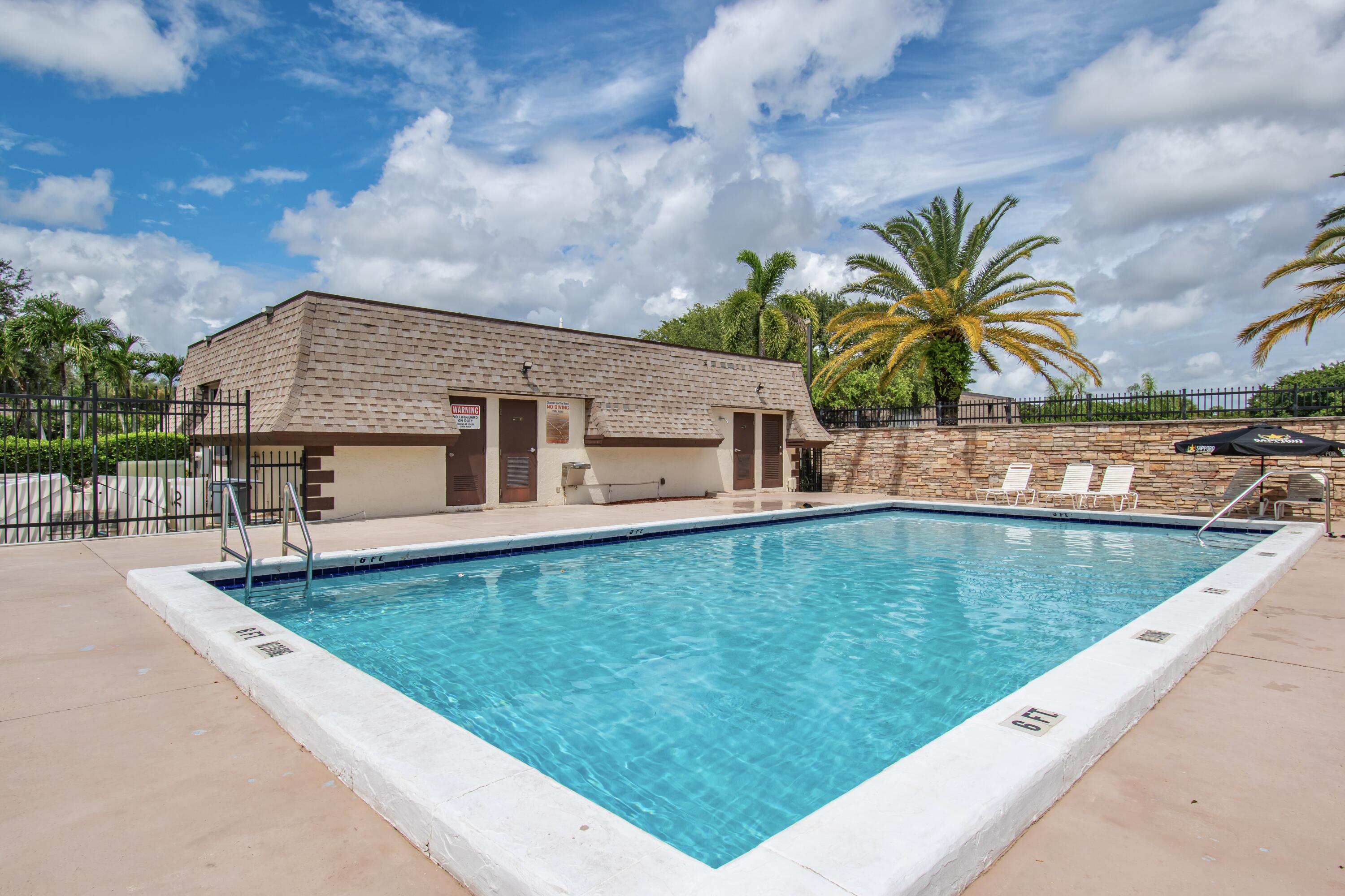 9460 Southwest 61st Way, Unit B Boca Raton, FL 33428 - Photo 29 of 31 a view of a house with swimming pool