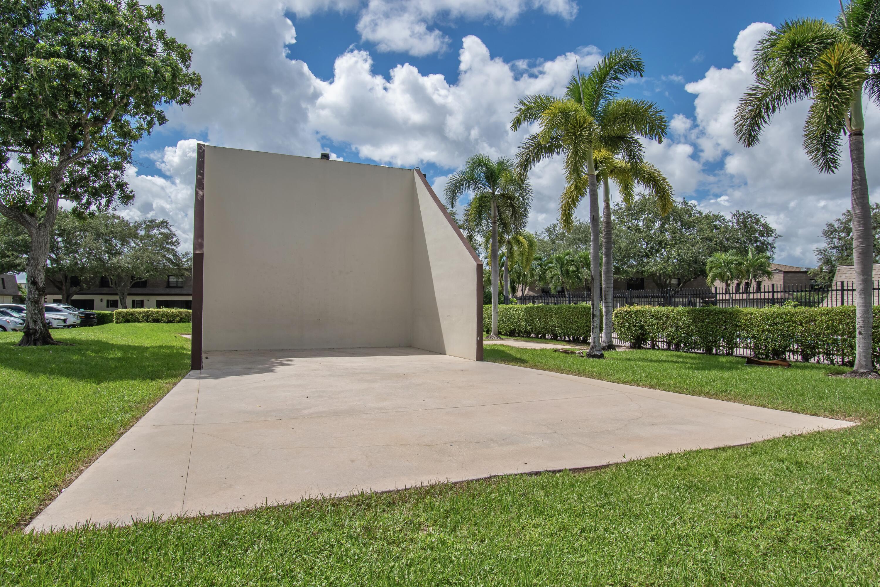 9460 Southwest 61st Way, Unit B Boca Raton, FL 33428 - Photo 31 of 31 a view of a yard with palm trees