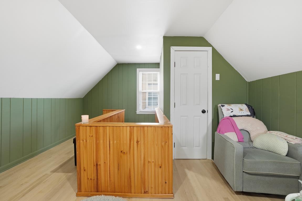 4240 Custer Avenue Brookfield, IL 60513 - Photo 11 of 28 a living room with furniture and a wooden floor