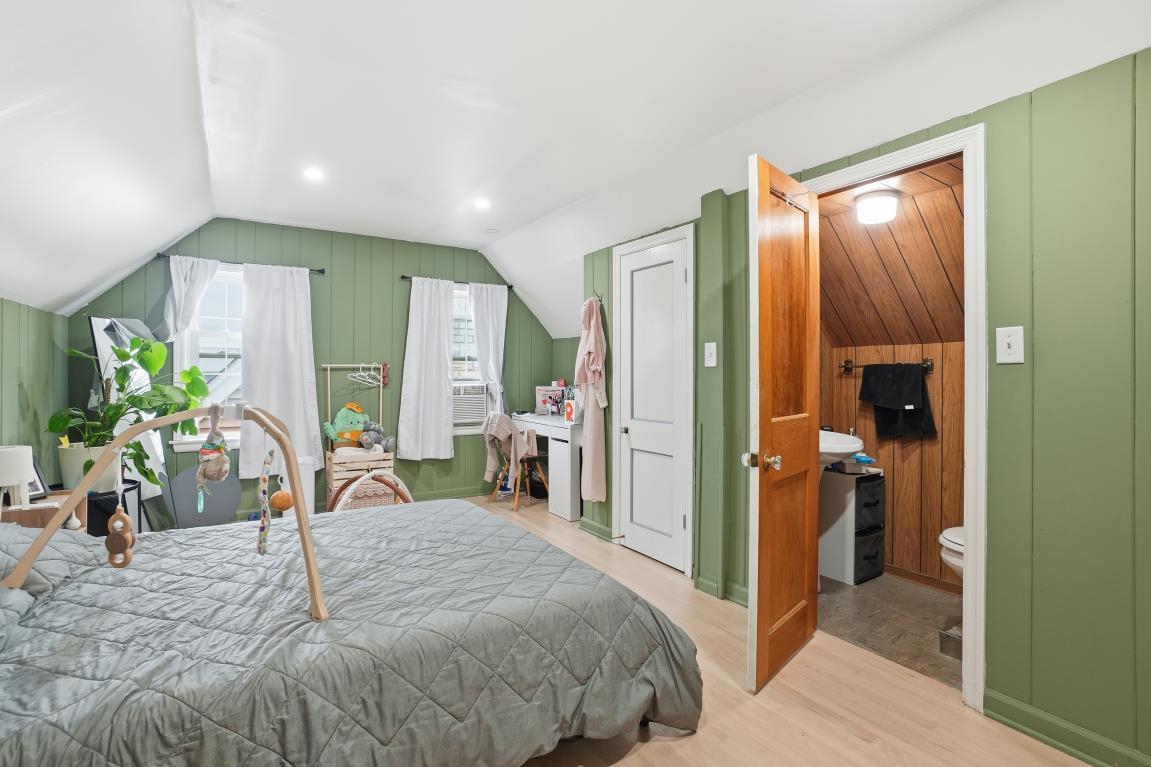 4240 Custer Avenue Brookfield, IL 60513 - Photo 13 of 28 a bedroom with a bed and a large mirror