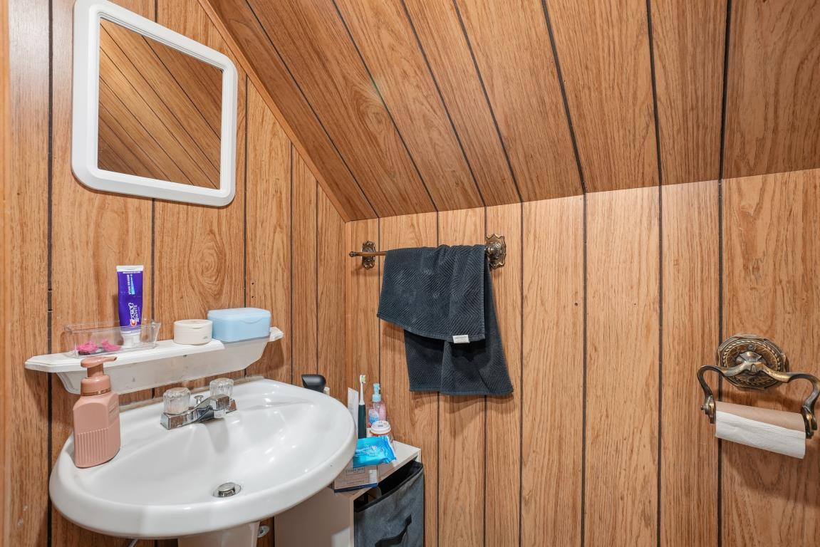 4240 Custer Avenue Brookfield, IL 60513 - Photo 14 of 28 a bathroom with a sink and a mirror