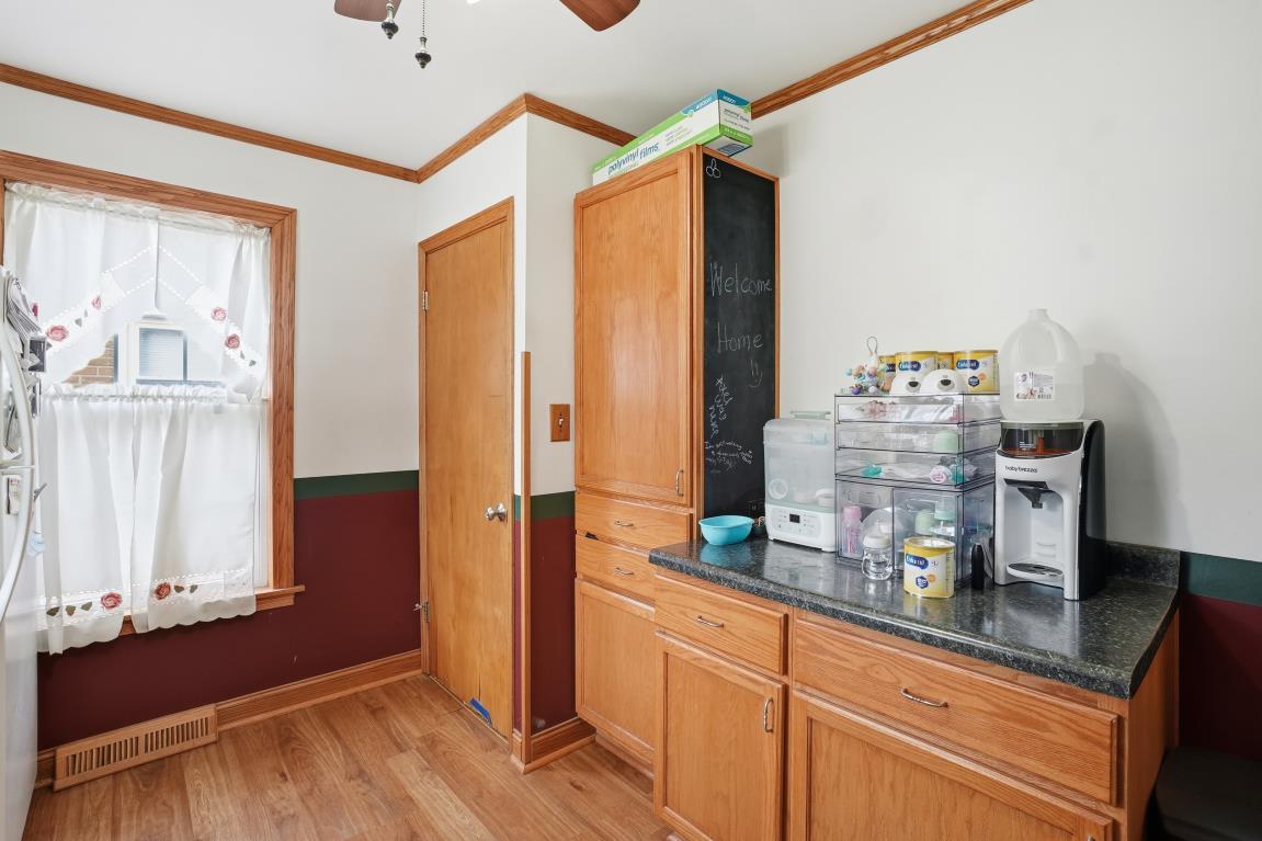 4240 Custer Avenue Brookfield, IL 60513 - Photo 16 of 28 a kitchen with stainless steel appliances a counter space and a window