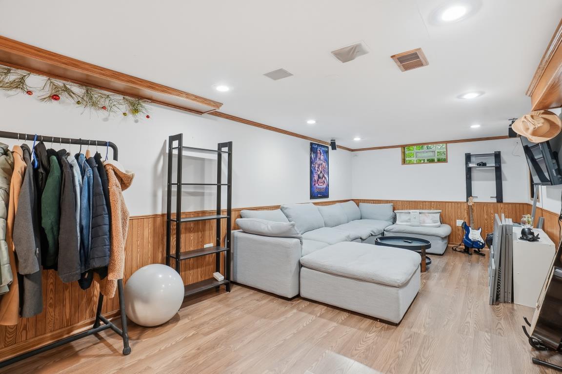 4240 Custer Avenue Brookfield, IL 60513 - Photo 18 of 28 a living room with furniture and a floor to ceiling window
