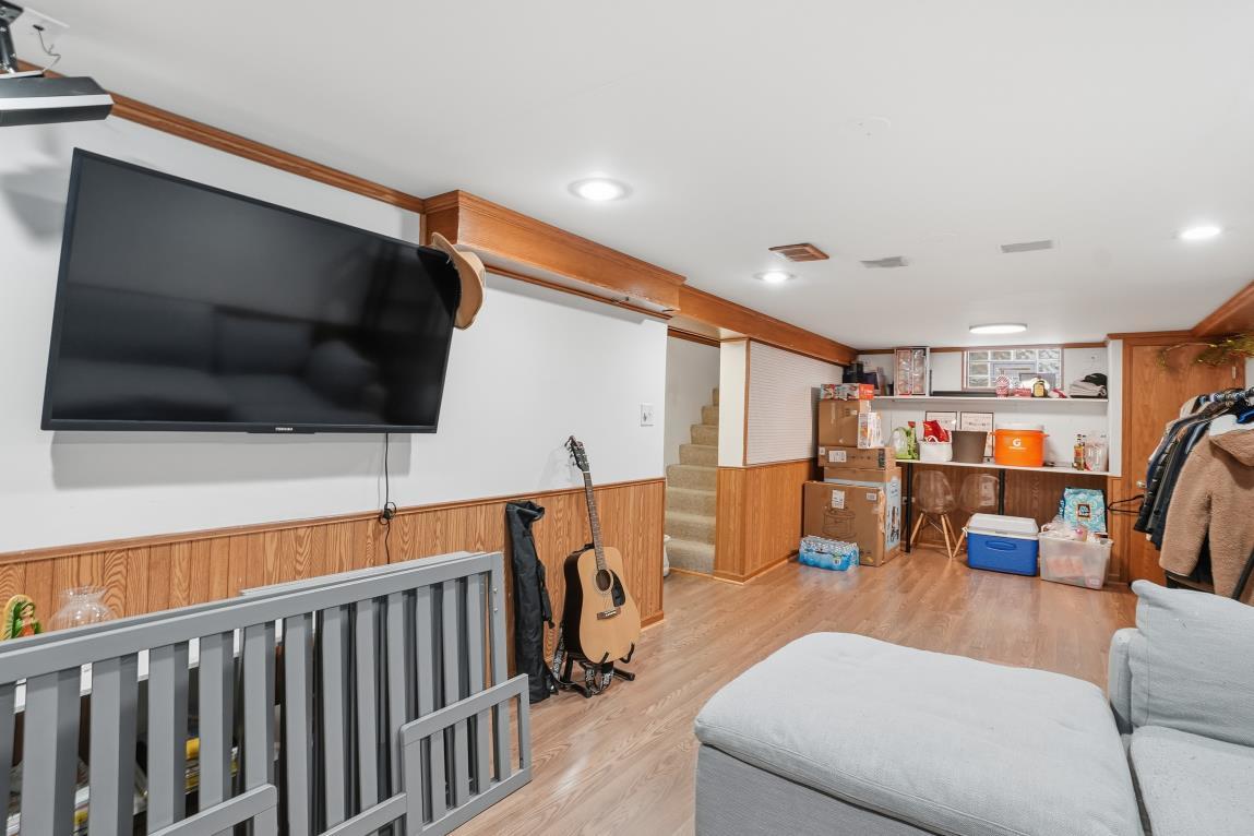 4240 Custer Avenue Brookfield, IL 60513 - Photo 19 of 28 a living room with furniture and a flat screen tv