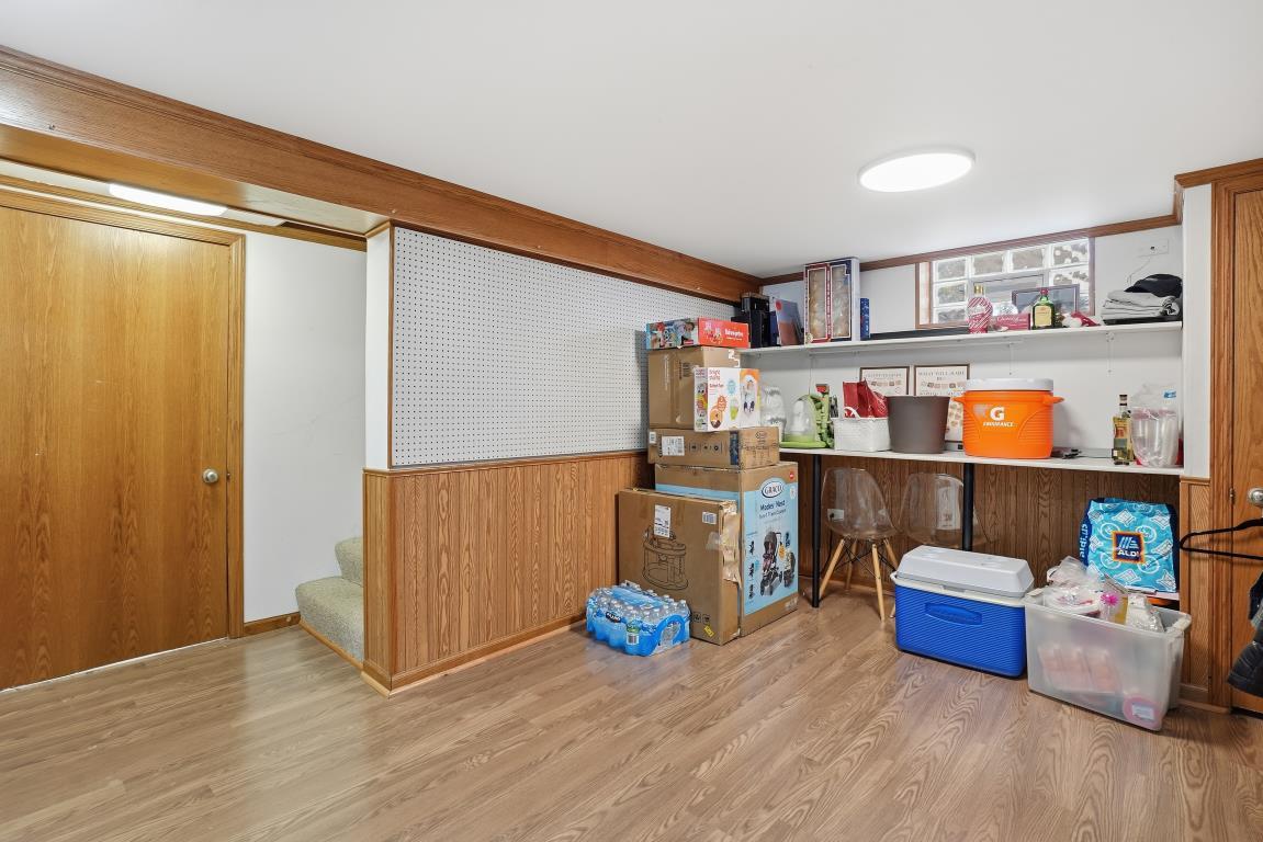 4240 Custer Avenue Brookfield, IL 60513 - Photo 21 of 28 a kitchen with blue cabinets and window