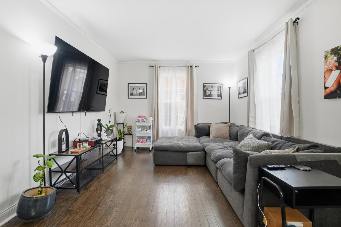 4240 Custer Avenue Brookfield, IL 60513 - Photo 3 of 28 a living room with furniture and a flat screen tv