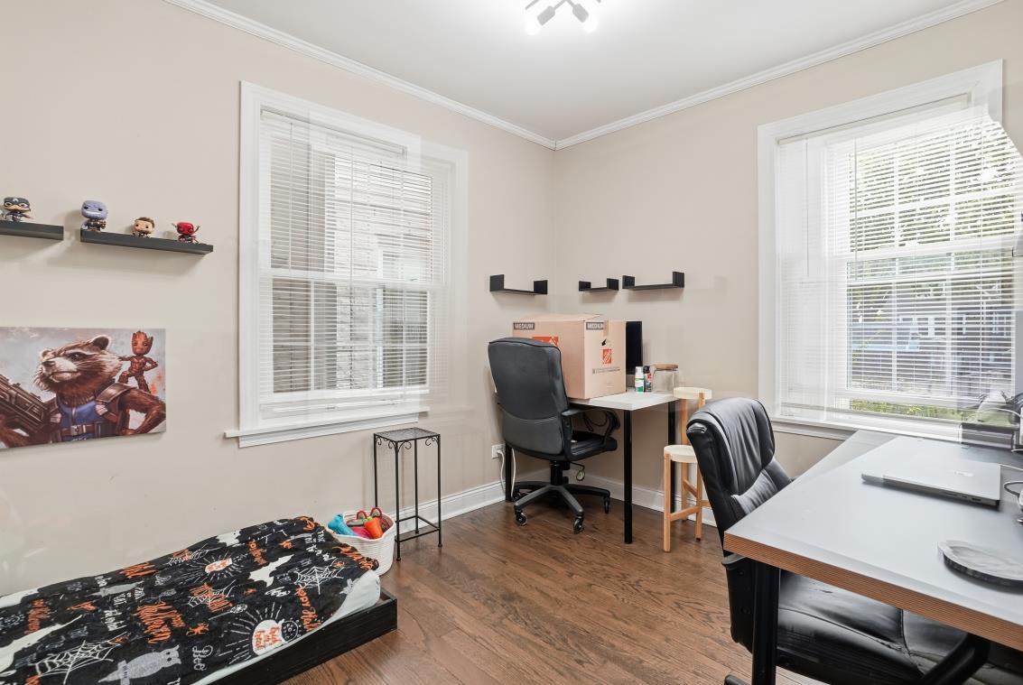 4240 Custer Avenue Brookfield, IL 60513 - Photo 8 of 28 a view of a workspace with furniture and a window