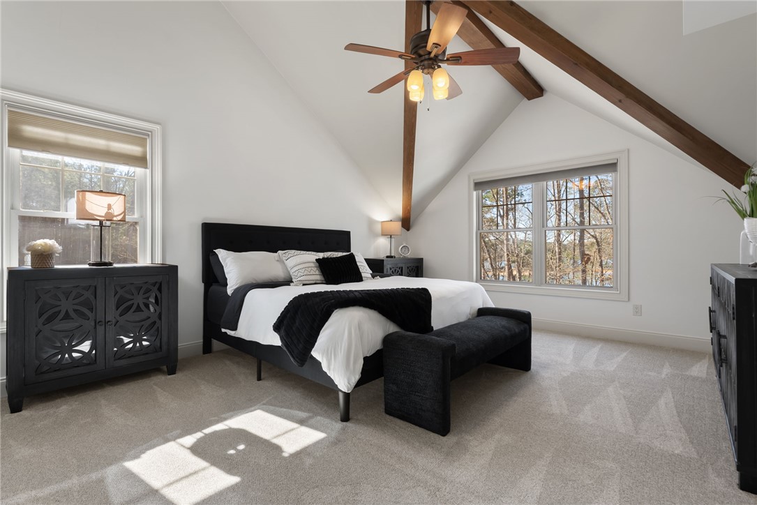 505 Northview Court Fair Play, SC 29643 - Photo 27 of 48 This spacious bedroom offers exposed beams, ample natural light, and plush carpeting for comfortable living.