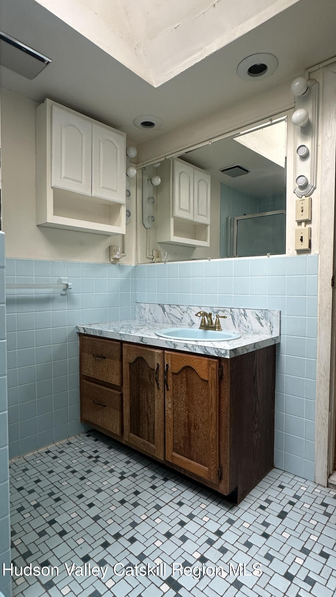 7 River Road, Unit TOWN ROAD Highland, NY 12528 - Photo 10 of 25 a bathroom with a sink and a mirror