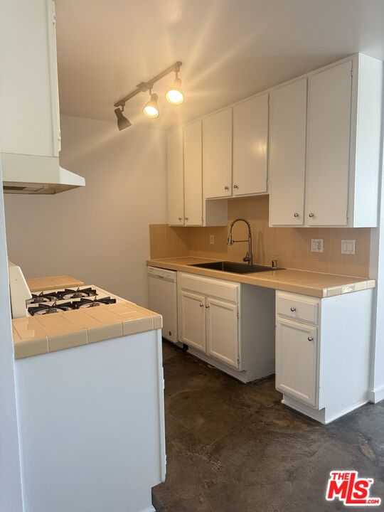 511 Rialto Avenue, Unit 1 Venice, CA 90291 - Photo 13 of 17 a kitchen with granite countertop a sink and a stove top oven