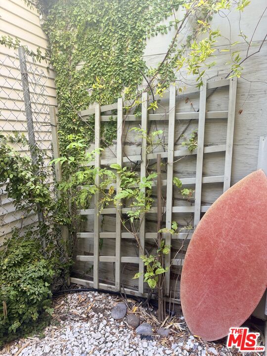 511 Rialto Avenue, Unit 1 Venice, CA 90291 - Photo 16 of 17 a view of a backyard with table and chairs and potted plants