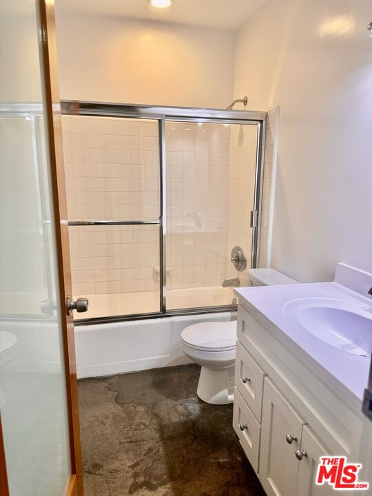 511 Rialto Avenue, Unit 1 Venice, CA 90291 - Photo 5 of 17 a bathroom with a granite countertop shower sink vanity mirror and toilet