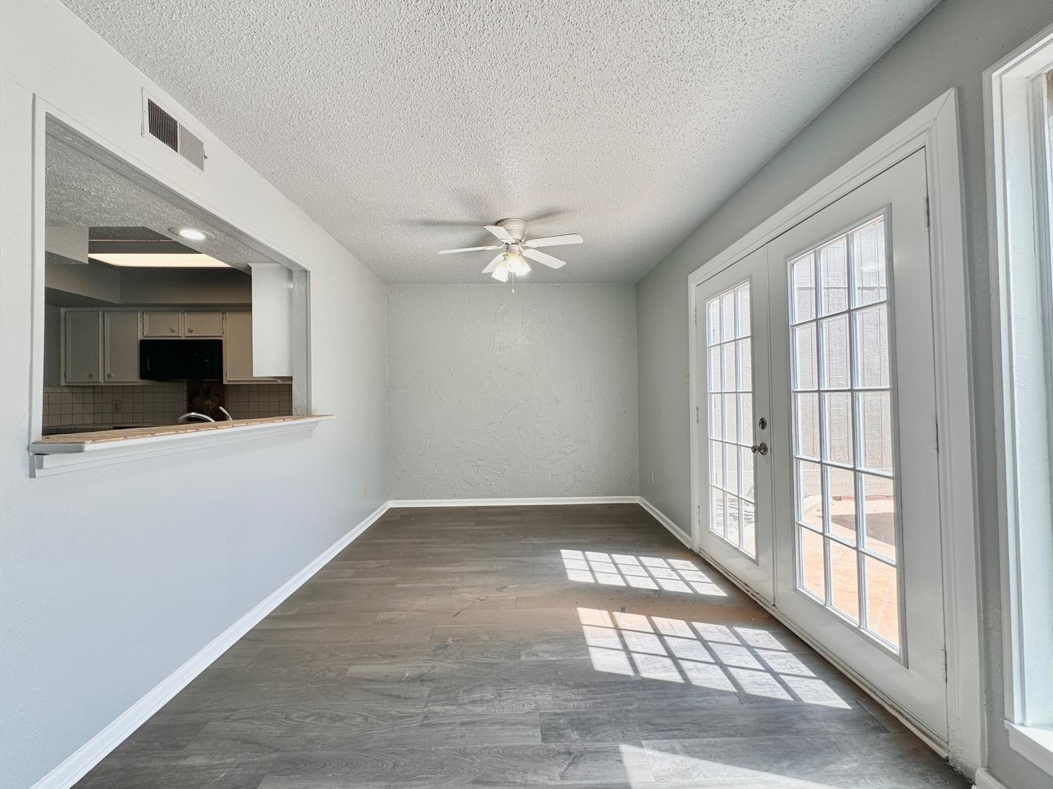 5763 38th Street Lubbock, TX 79407 - Photo 6 of 16 a view of an empty room with a window
