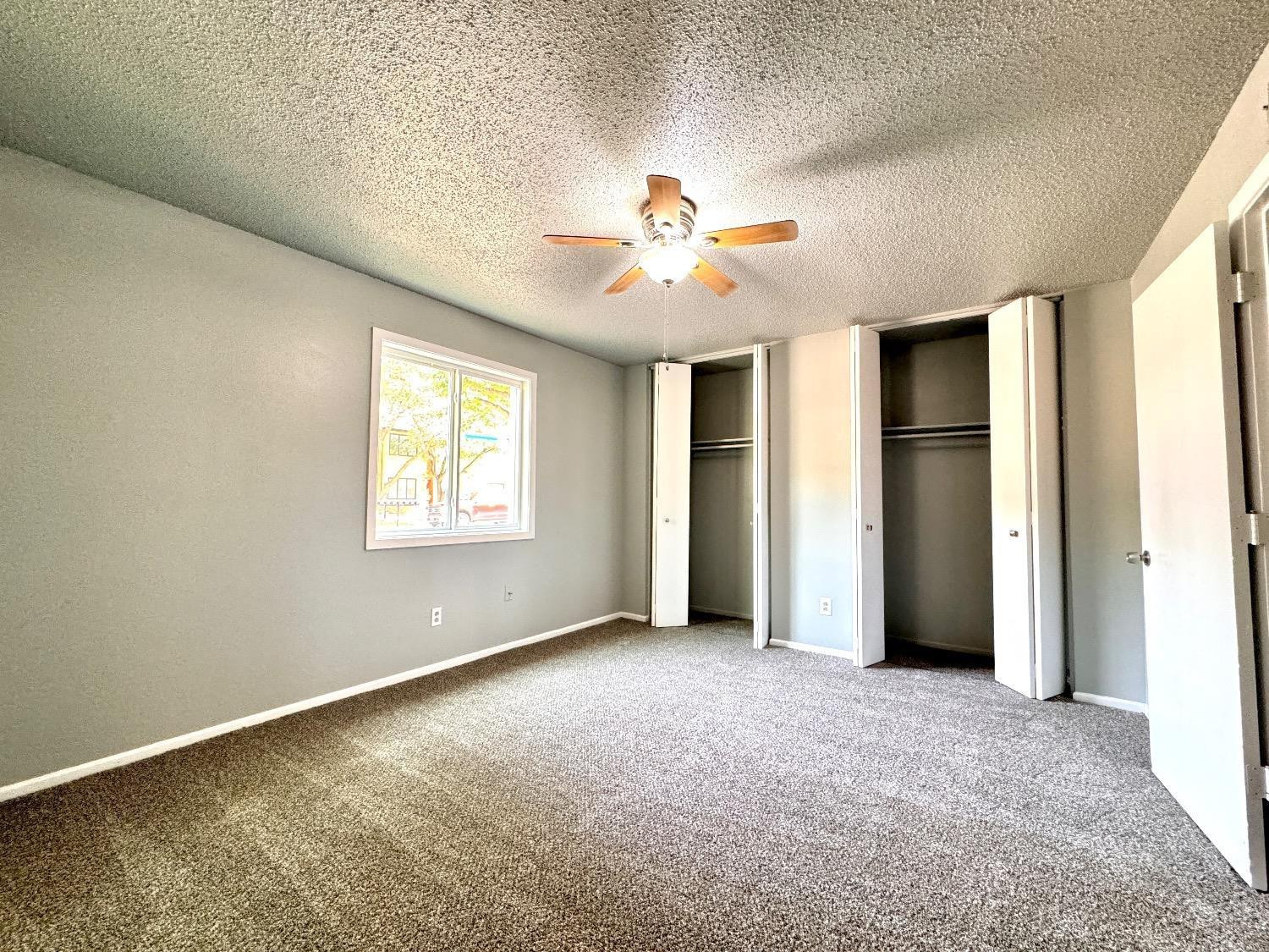 5763 38th Street Lubbock, TX 79407 - Photo 9 of 16 a view of an empty room with a window