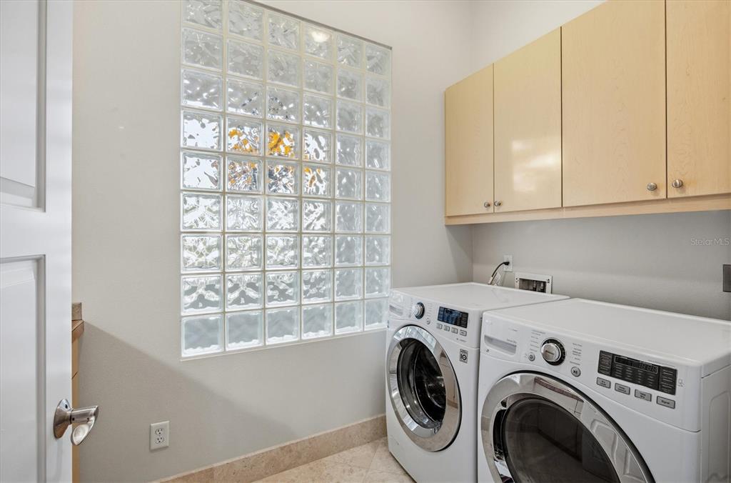 761 Norton Street Longboat Key, FL 34228 - Photo 49 of 66 a utility room with dryer and washer