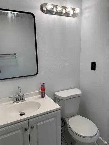 a view of a room with wooden floor and sink