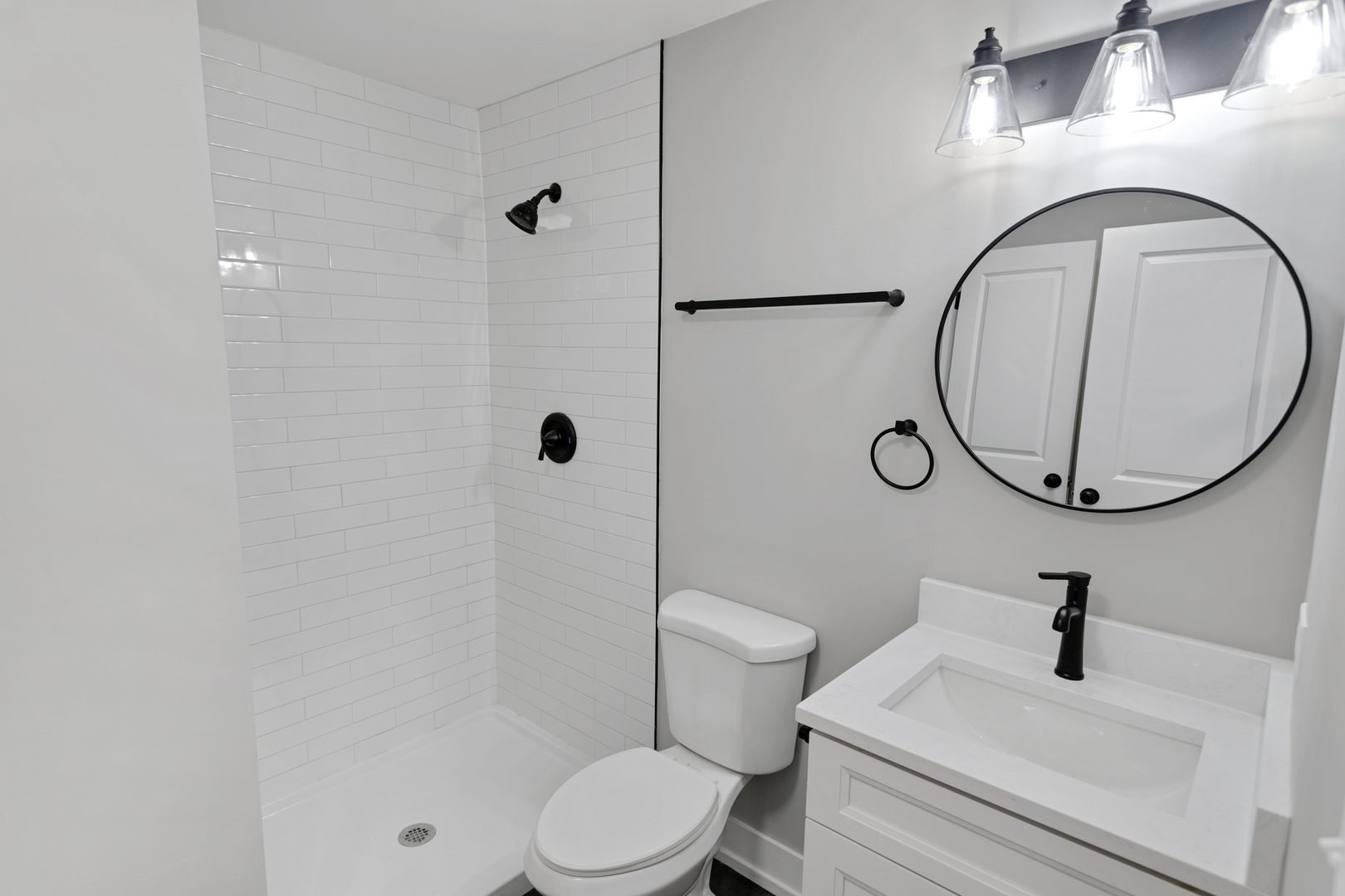 28W555 Leverenz Road Naperville, IL 60564 - Photo 9 of 21 a bathroom with a sink a toilet and a mirror