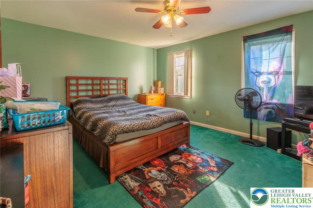 2170 Clearview Road Coplay, PA 18037 - Photo 44 of 75 This spacious bedroom offers ample natural light and a comfortable atmosphere for relaxation.