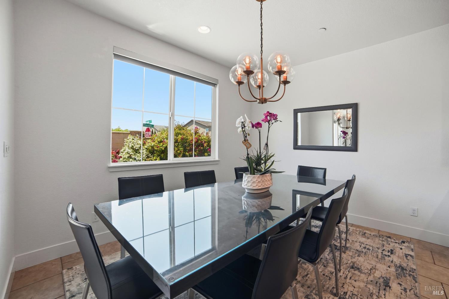 5305 Kirby Place Rohnert Park, CA 94928 - Photo 11 of 37 a view of a dining room with furniture a chandelier and wooden floor