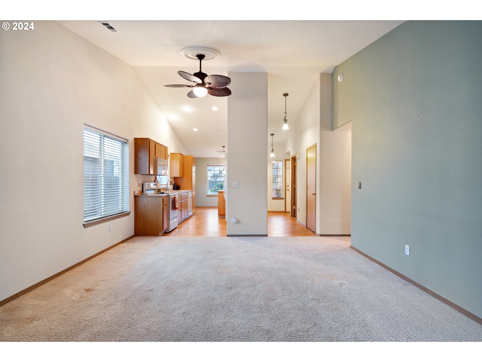 13509 Northeast 77th Street Vancouver, WA 98682 - Photo 11 of 29 a view of a big room with wooden floor and windows