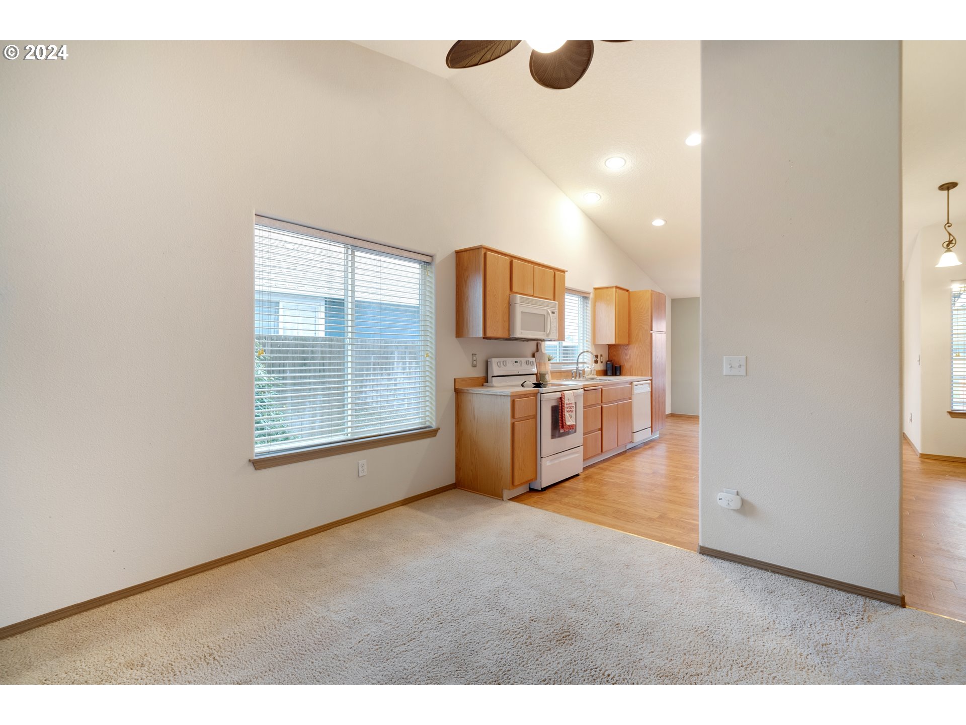 13509 Northeast 77th Street Vancouver, WA 98682 - Photo 12 of 29 a view of a kitchen with furniture and wooden floor