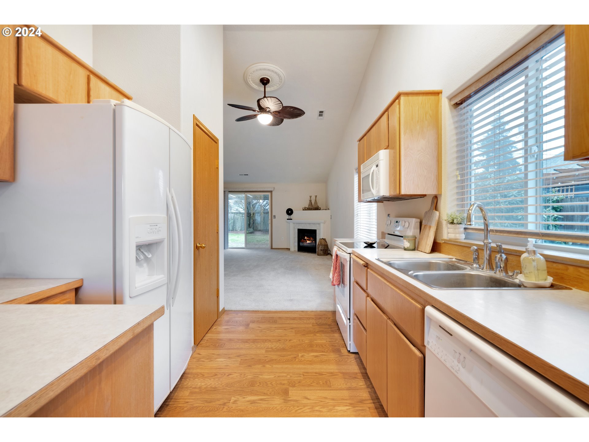 13509 Northeast 77th Street Vancouver, WA 98682 - Photo 16 of 29 a kitchen with a sink a counter top space and stainless steel appliances