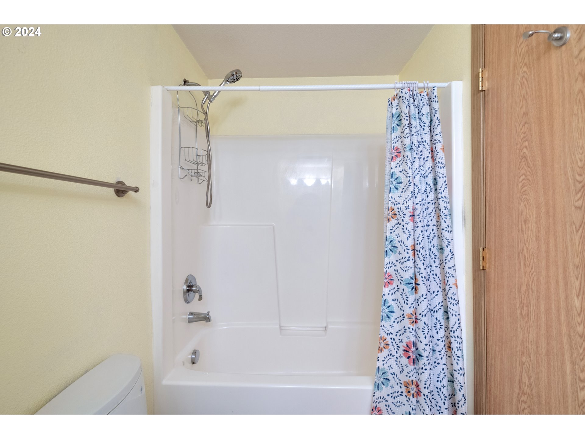 13509 Northeast 77th Street Vancouver, WA 98682 - Photo 19 of 29 a bathroom with a shower curtain and a shower