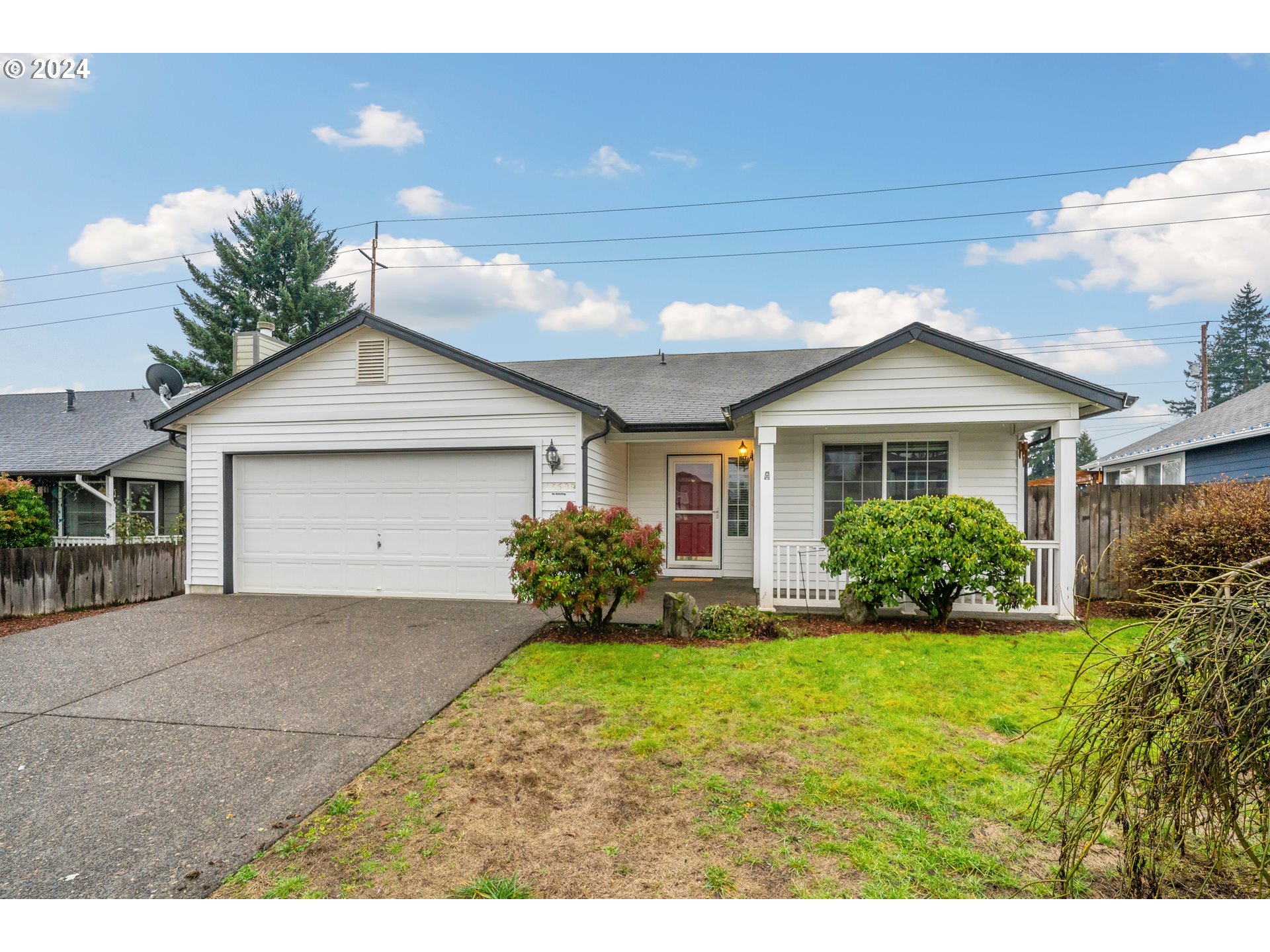 13509 Northeast 77th Street Vancouver, WA 98682 - Photo 3 of 29 a front view of a house with a garden and yard