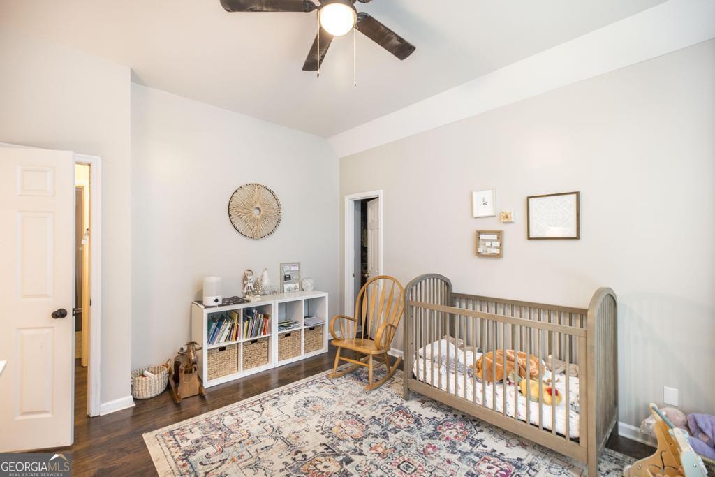 128 Springwood Court Macon, GA 31210 - Photo 14 of 22 a bedroom with furniture and a window