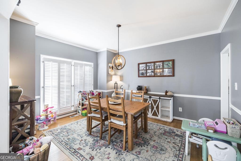128 Springwood Court Macon, GA 31210 - Photo 7 of 22 a view of a dining room with furniture window and wooden floor