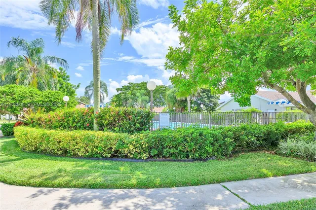 a view of a garden with a bench