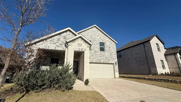 a front view of a house with yard