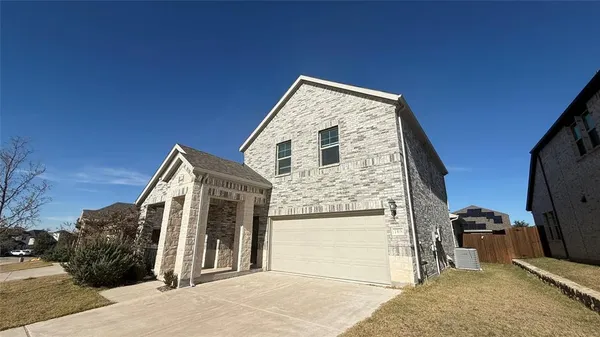 a view of a house with a snow in the background