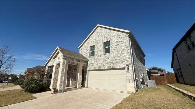 a view of a house with a snow in the background