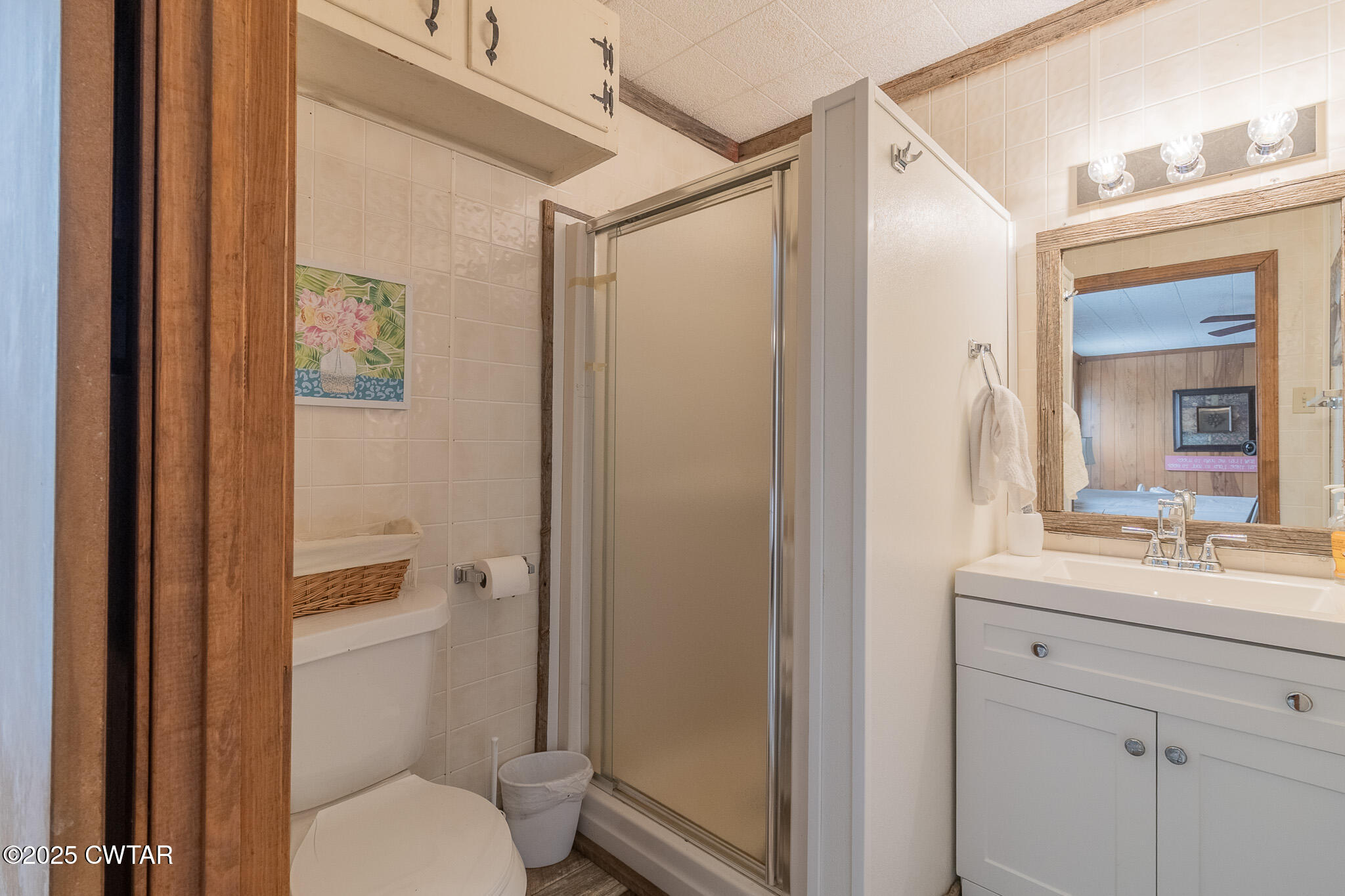 525 Wesley Lake Road Brownsville, TN 38012 - Photo 11 of 21 a bathroom with a shower a sink a toilet and a mirror