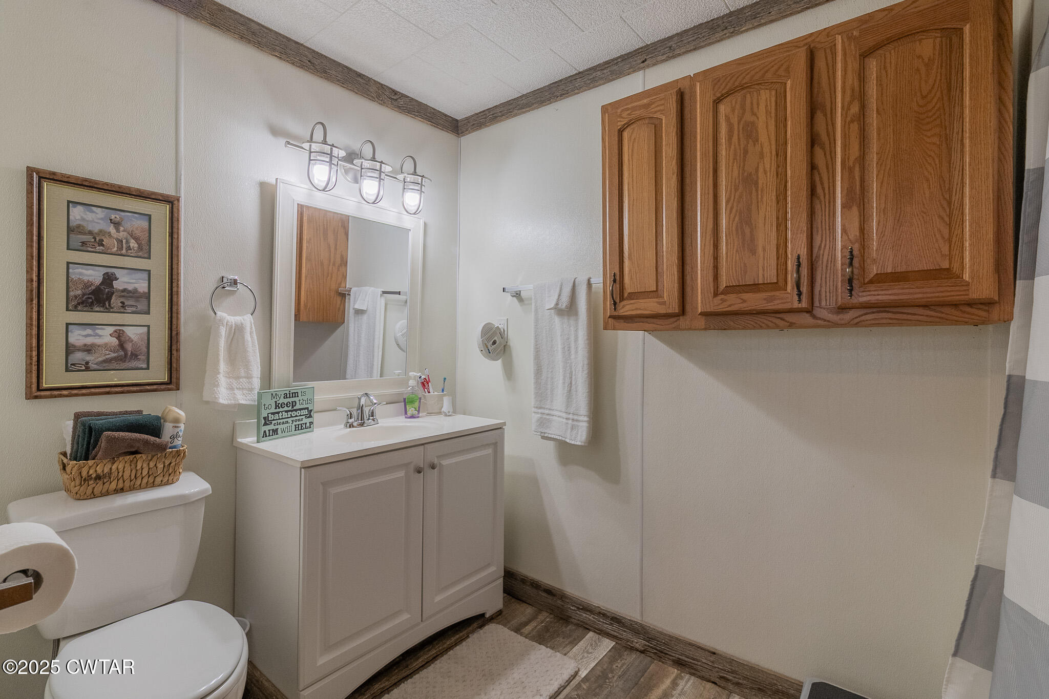525 Wesley Lake Road Brownsville, TN 38012 - Photo 14 of 21 a bathroom with a toilet a sink and mirror