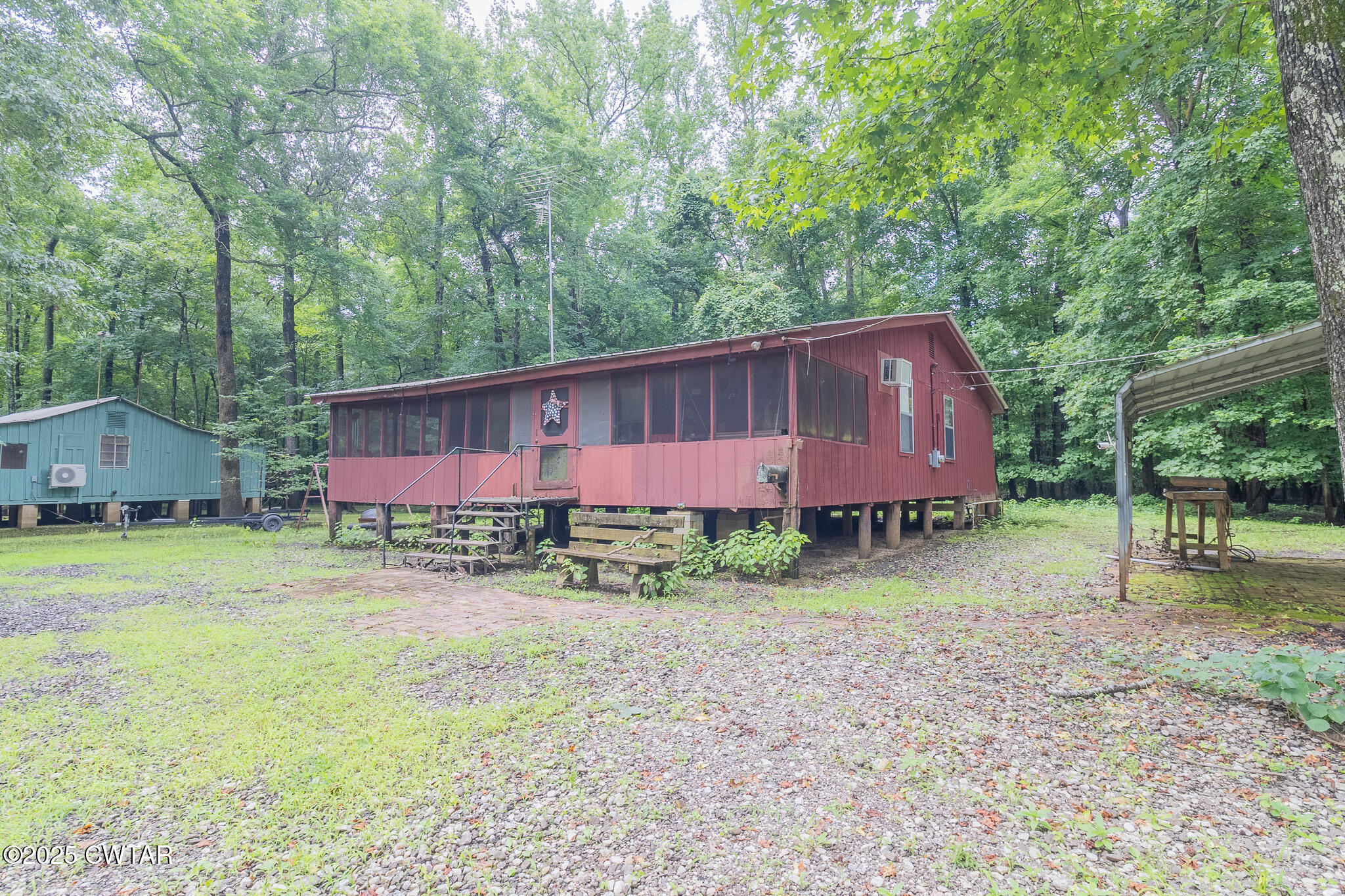 525 Wesley Lake Road Brownsville, TN 38012 - Photo 16 of 21 a view of backyard with green space and trampoline