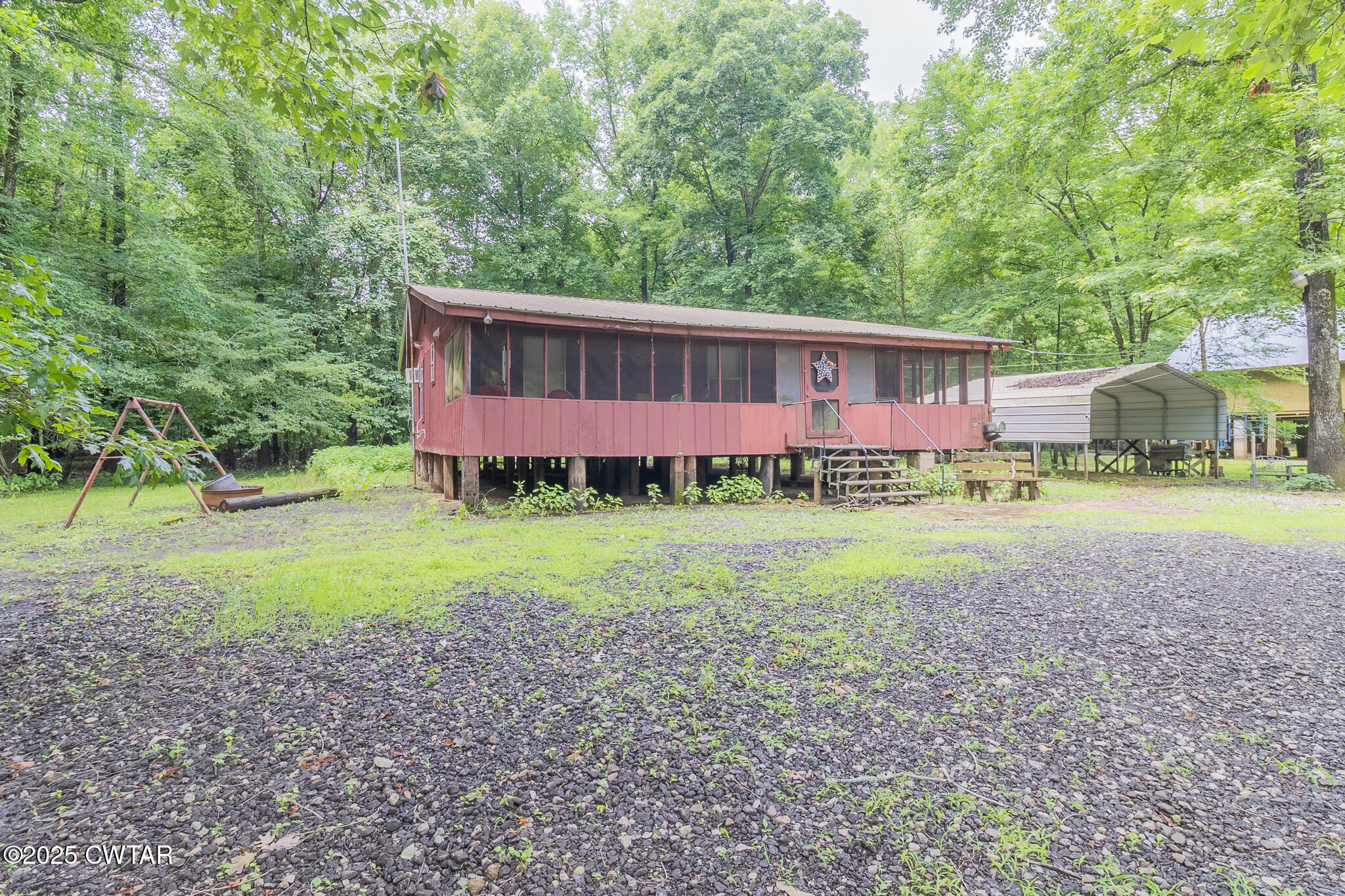 525 Wesley Lake Road Brownsville, TN 38012 - Photo 17 of 21 a view of a house with a yard and sitting area
