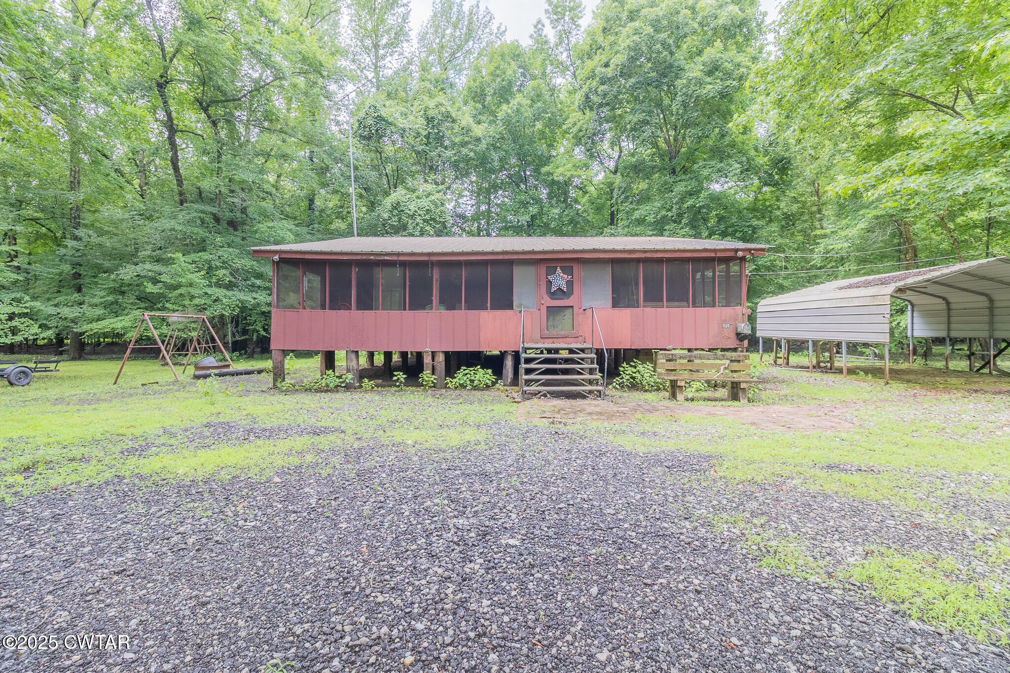 525 Wesley Lake Road Brownsville, TN 38012 - Photo 3 of 21 a view of a house with backyard and garden